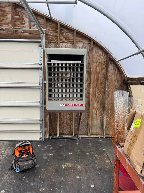Heating unit inside a greenhouse for temperature control in Maple Grove