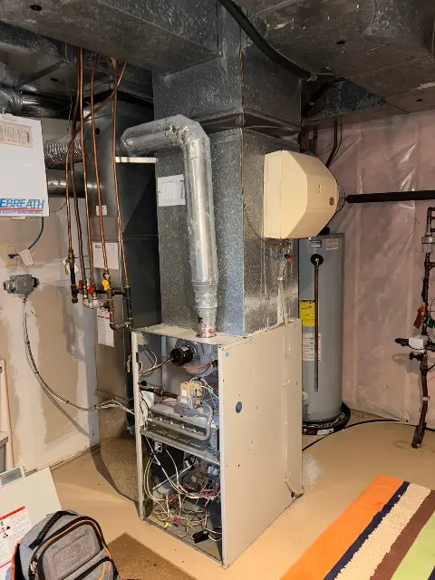 HVAC system with ductwork in a basement setting in Maple Grove