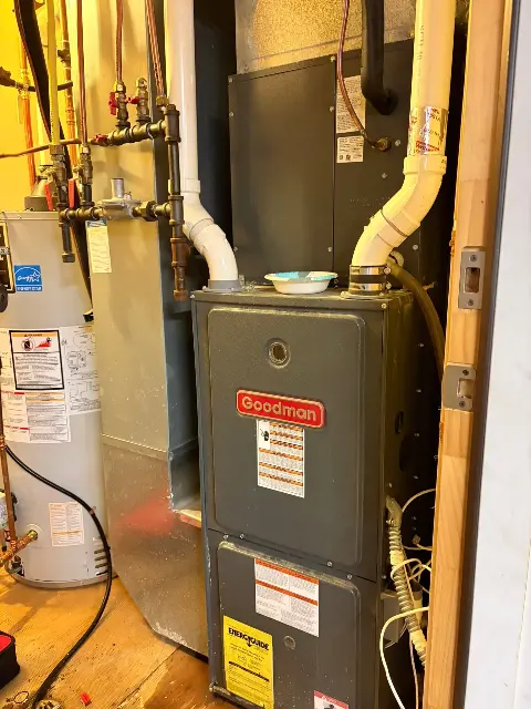 Goodman furnace installation with water heater in a utility room in Maple Grove