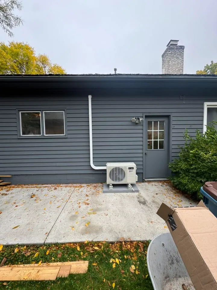 Ductless mini-split installed on a home's exterior wall