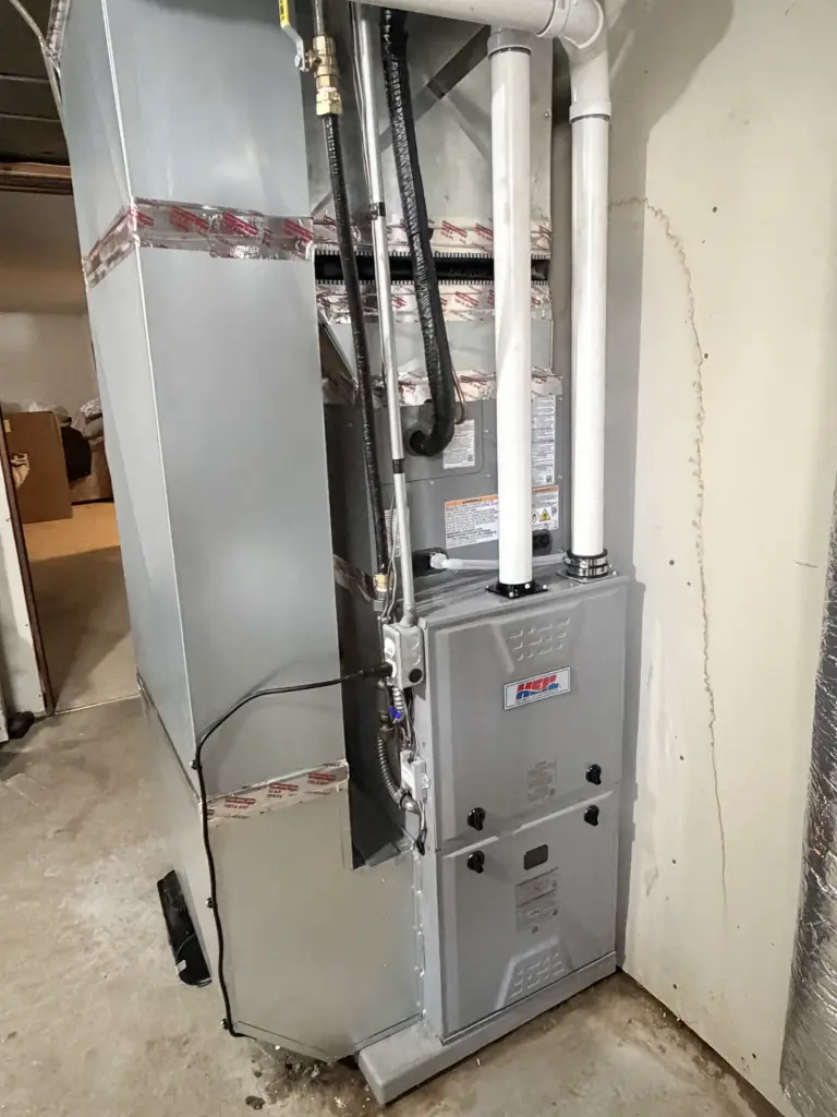 Furnace installation in a basement with ductwork in Maple Grove